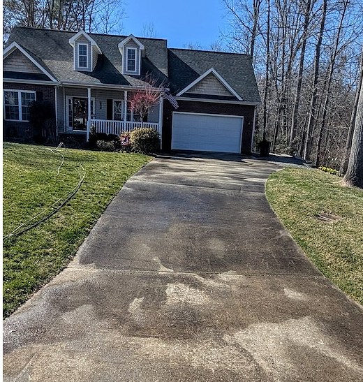 Driveway before pressure washing